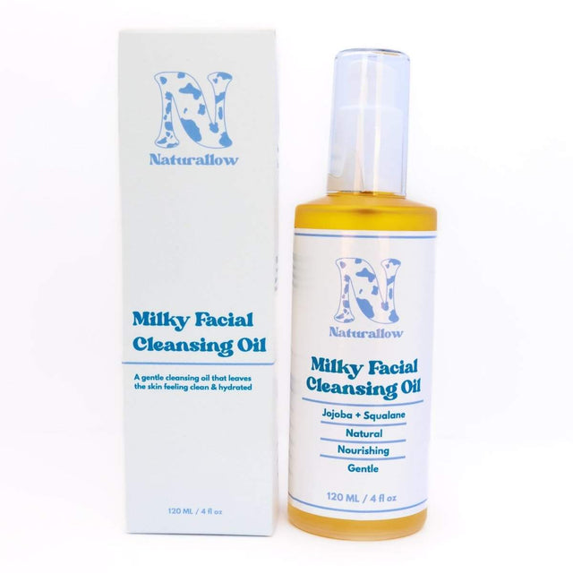 Naturallow's Milky Facial Cleansing Oil bottle and box standing next to each other against a white background