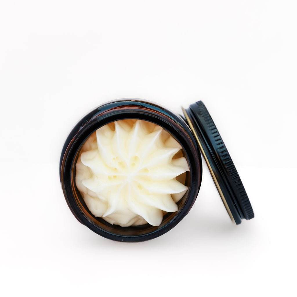 Naturallow's Whipped Tallow Moisturizer Jar Lying On It's Side Revealing The Swirled Tallow Inside