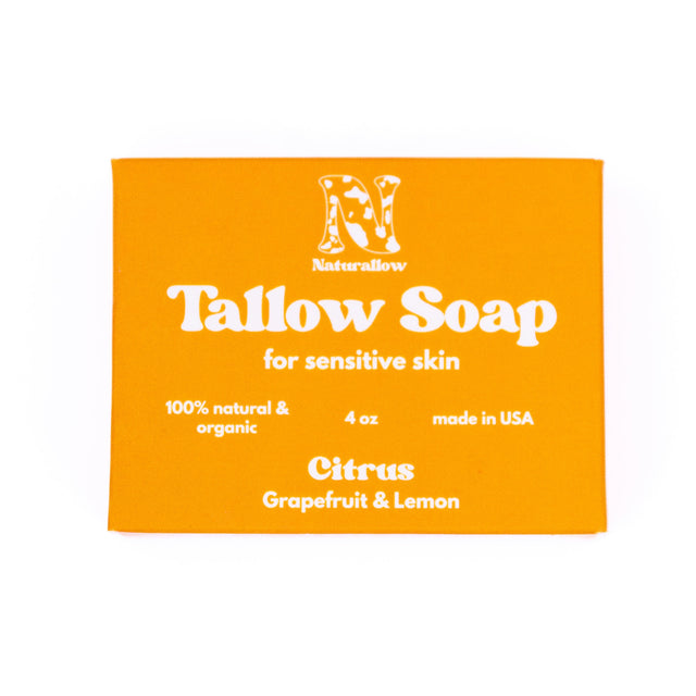 A rectangular orange box for a soap bar of Naturallow Tallow Soap for sensitive skin, Citrus Grapefruit & Lemon scent, on a solid white background.