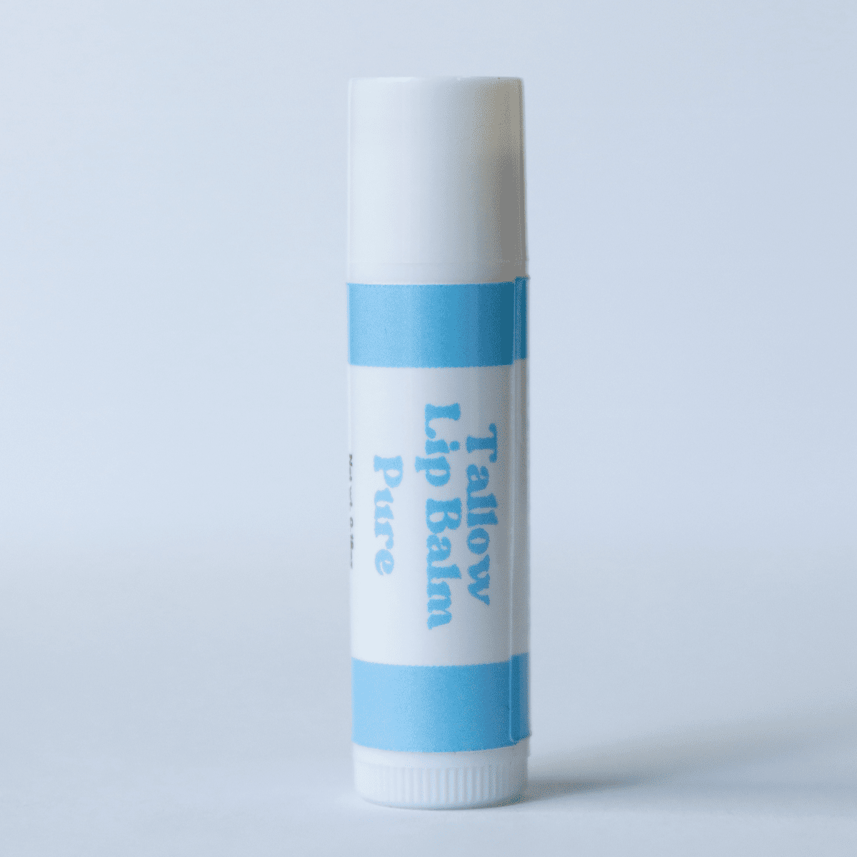 Naturallow's Pure Unscented Tallow Lip Balm Standing against a White Background