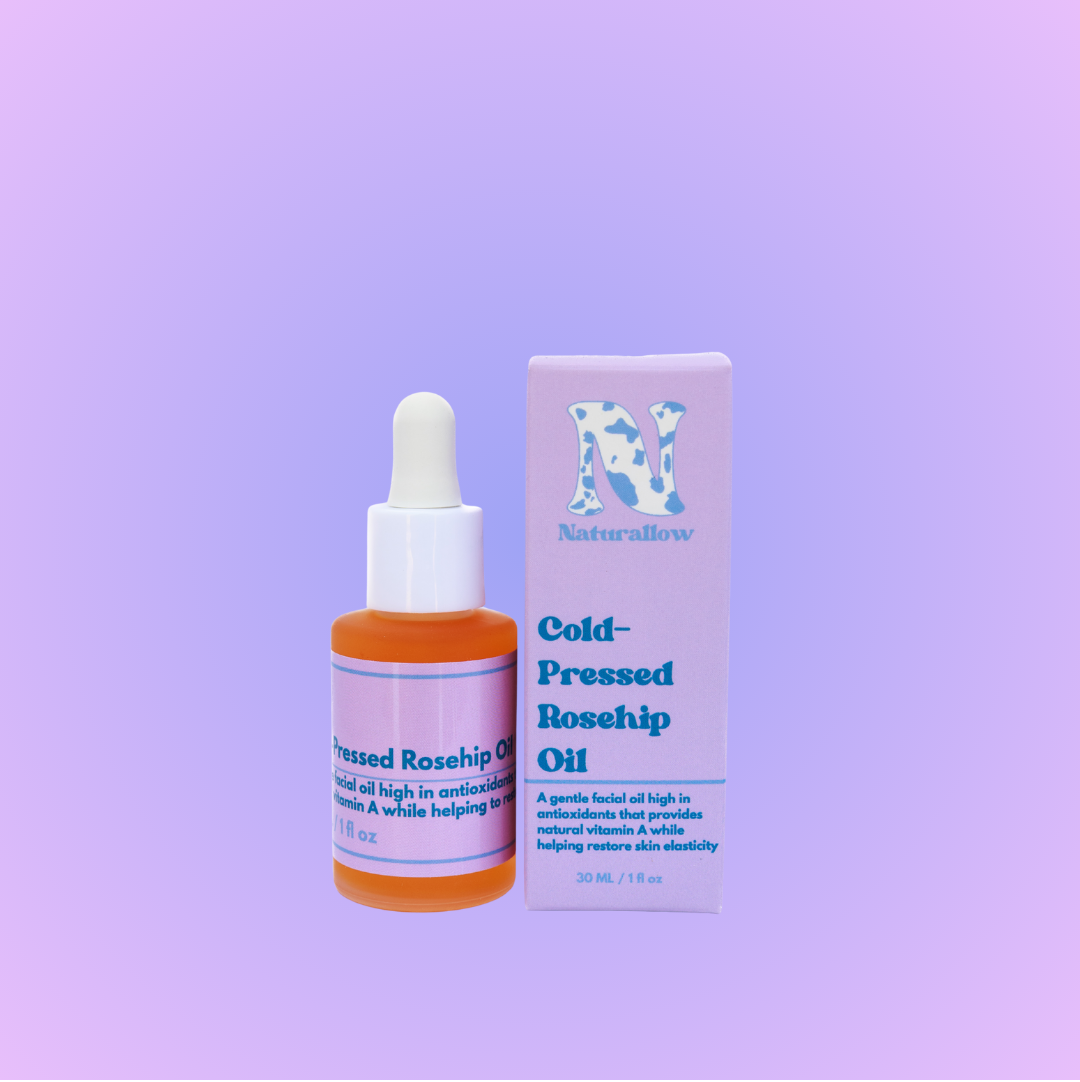 Rosehip oil bottle and packaging on a pink gradient background
