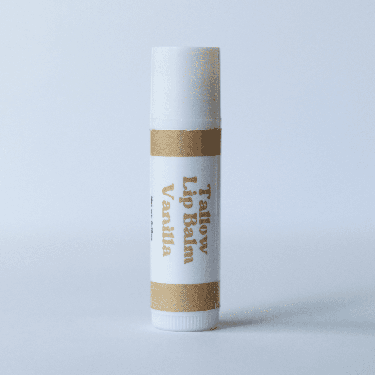 Naturallow's Vanilla Tallow Lip Balm Standing against a White Background
