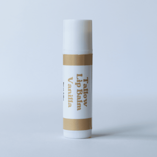 Naturallow's Vanilla Tallow Lip Balm Standing against a White Background